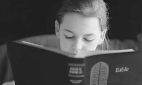 Girl reading the bible