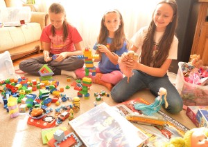 girls playing with dolls