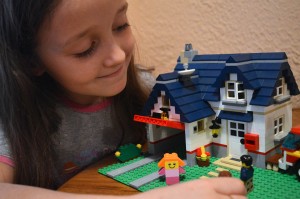 girl playing with lego