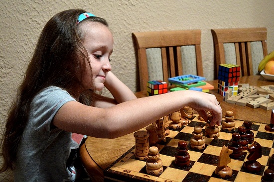 girl playing chess